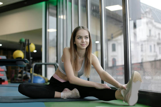 A woman doing stretching Seated Hamstring Stretch